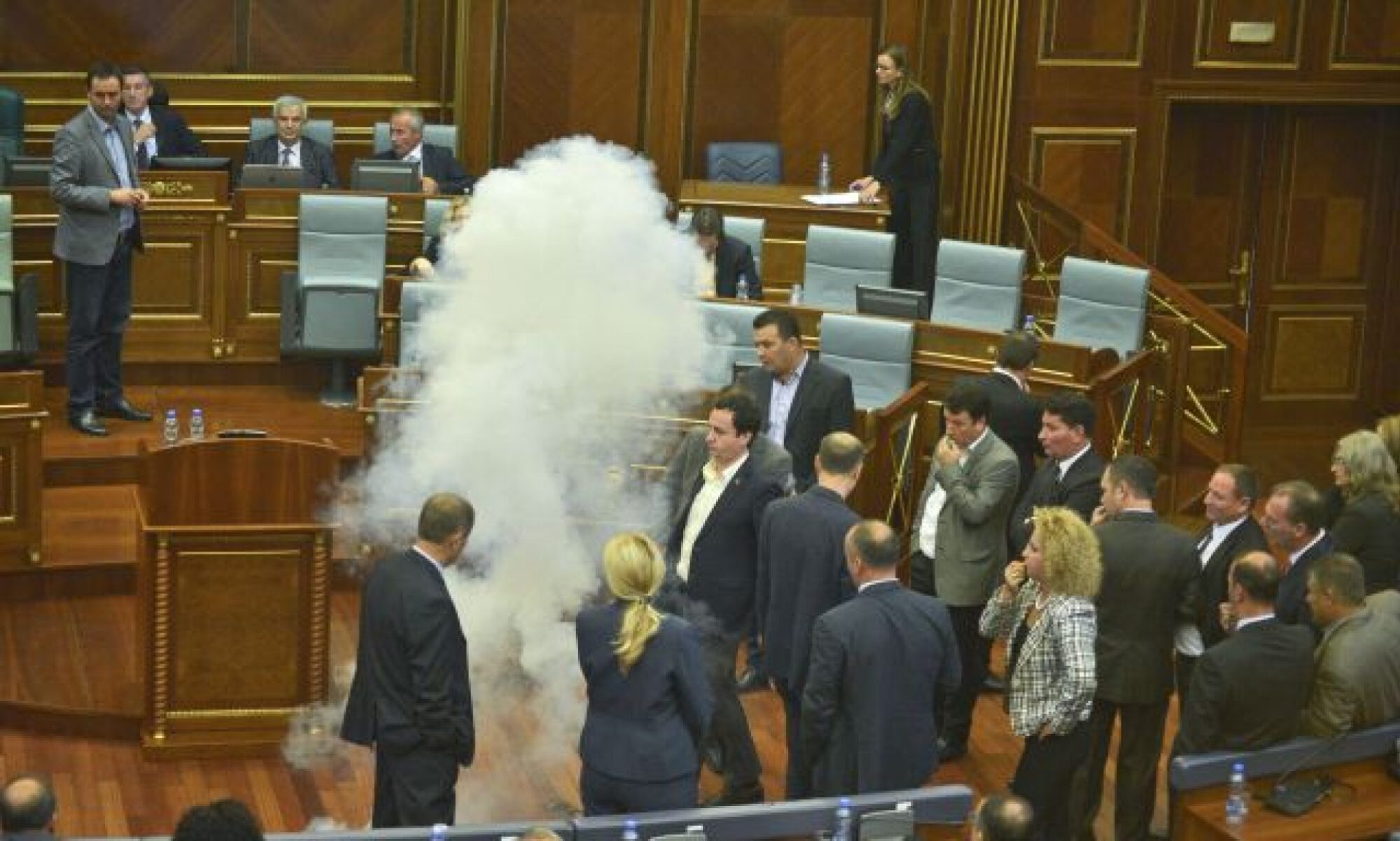 A smoke-bomb going off in the Kosovo Parliament